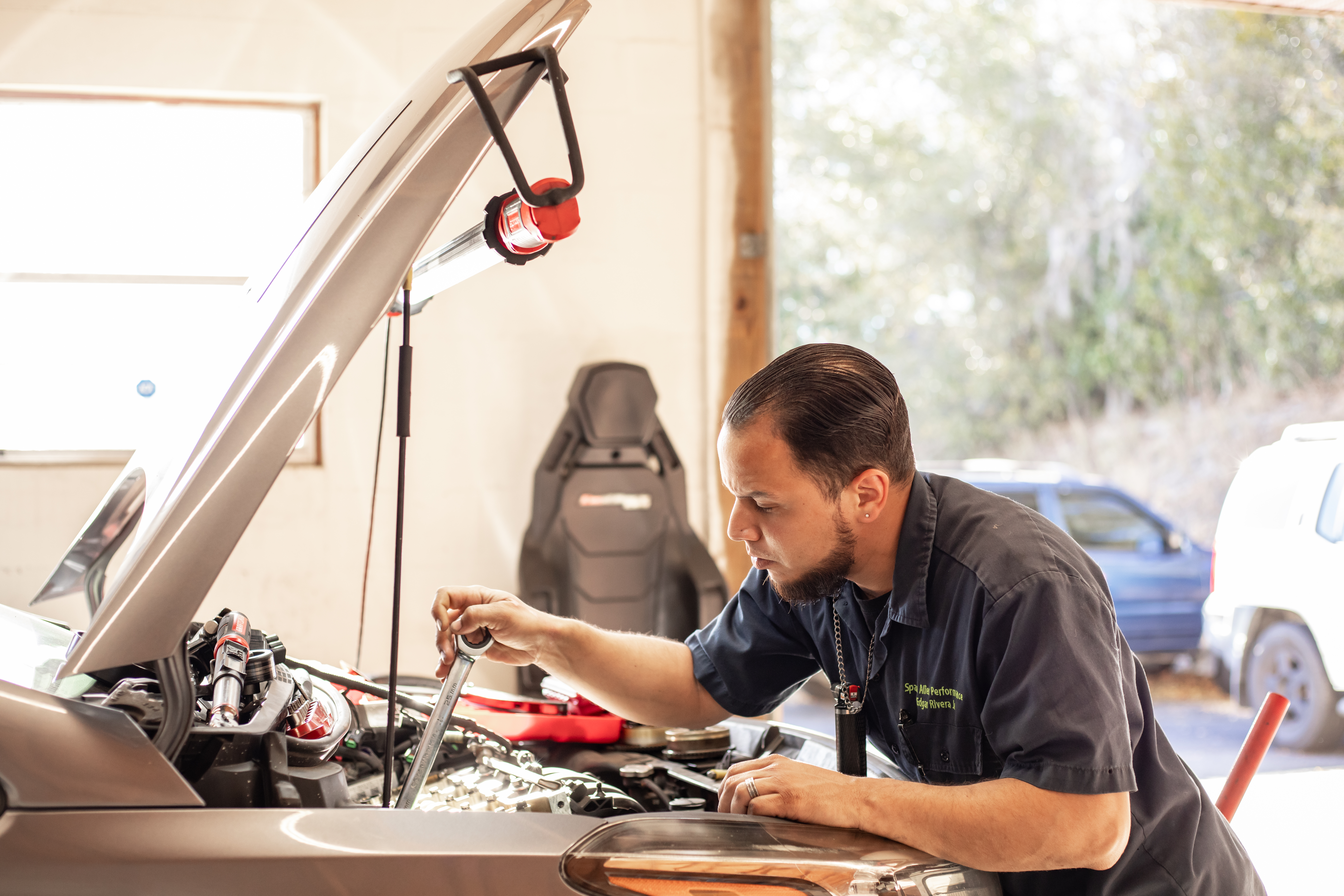 Mechanic performing engine repair at Space Alien Performance Summerfield FL