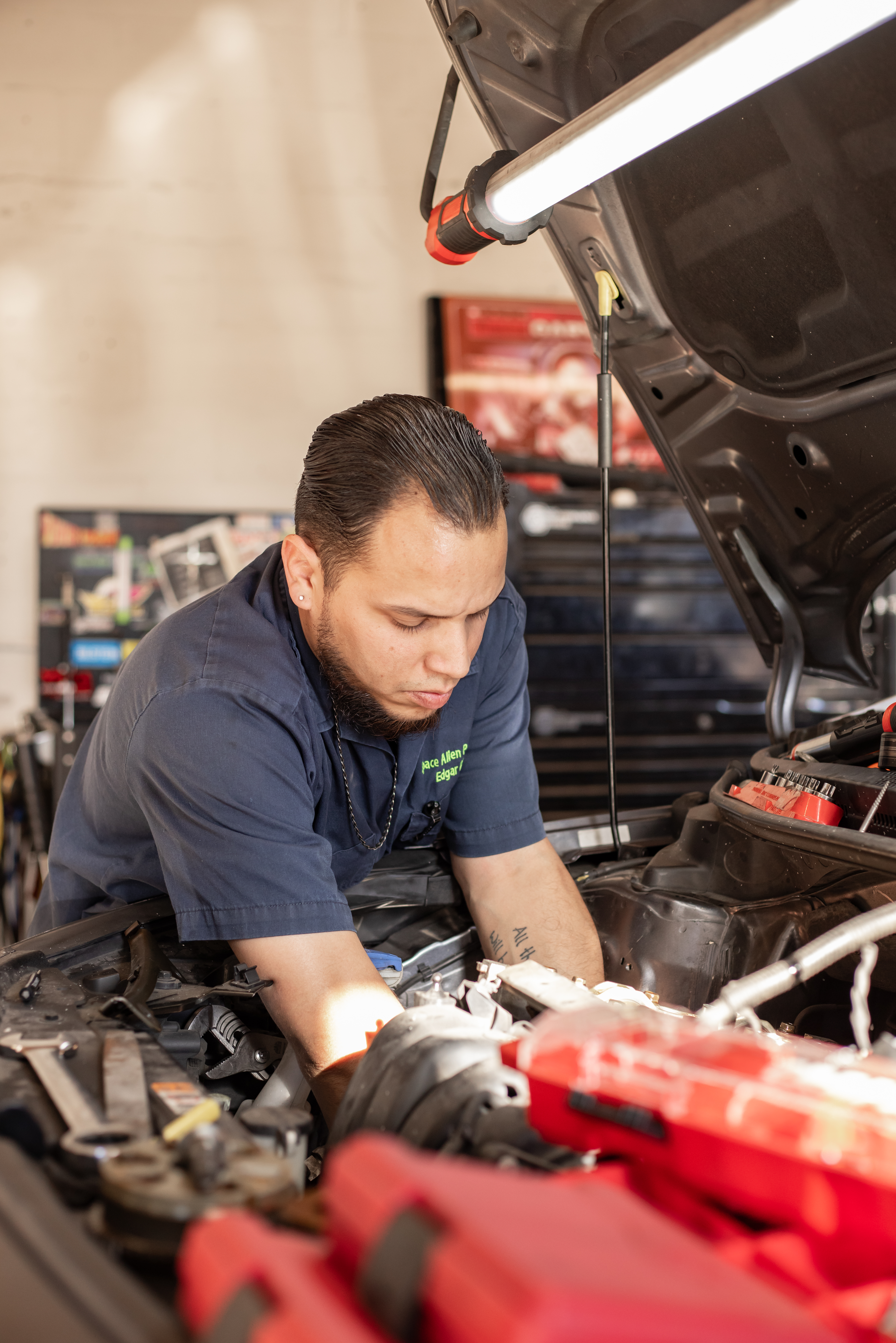Detailed engine bay diagnostic work at Space Alien Performance auto repair shop